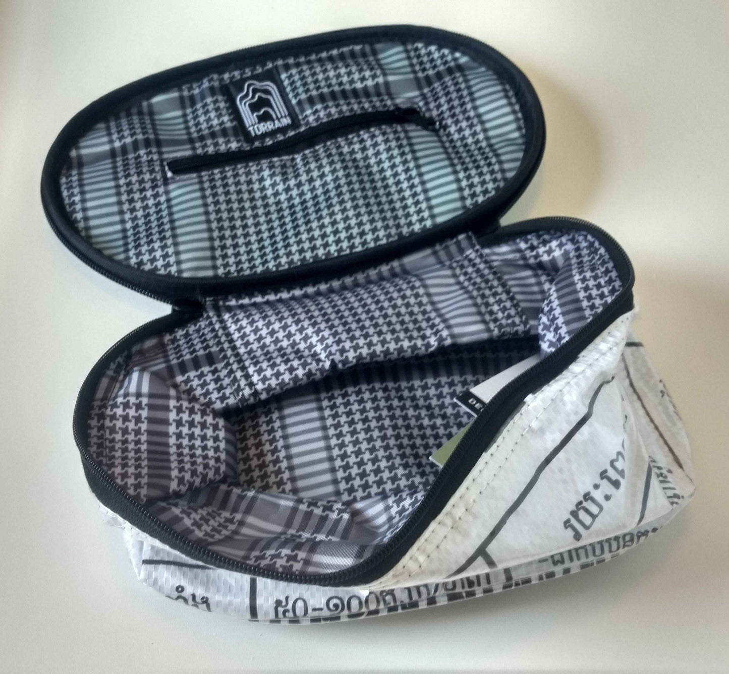 Interior view of Shebang Makeup Bag - Plasticology showing spacious, lined compartment with elastic pockets, perfect for organizing toiletries or cosmetics.