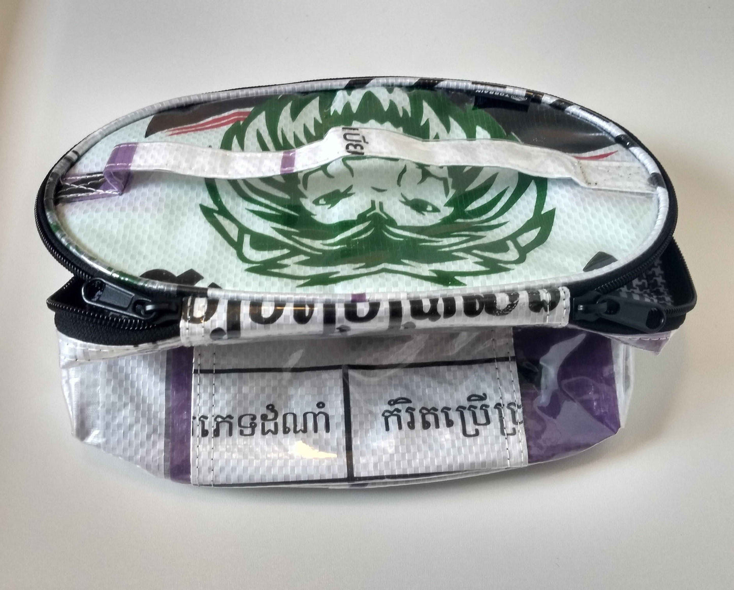 Shebang Makeup Bag - Plasticology made from upcycled cement bags with waterproof exterior and zip closure, ideal for travel or daily use.
