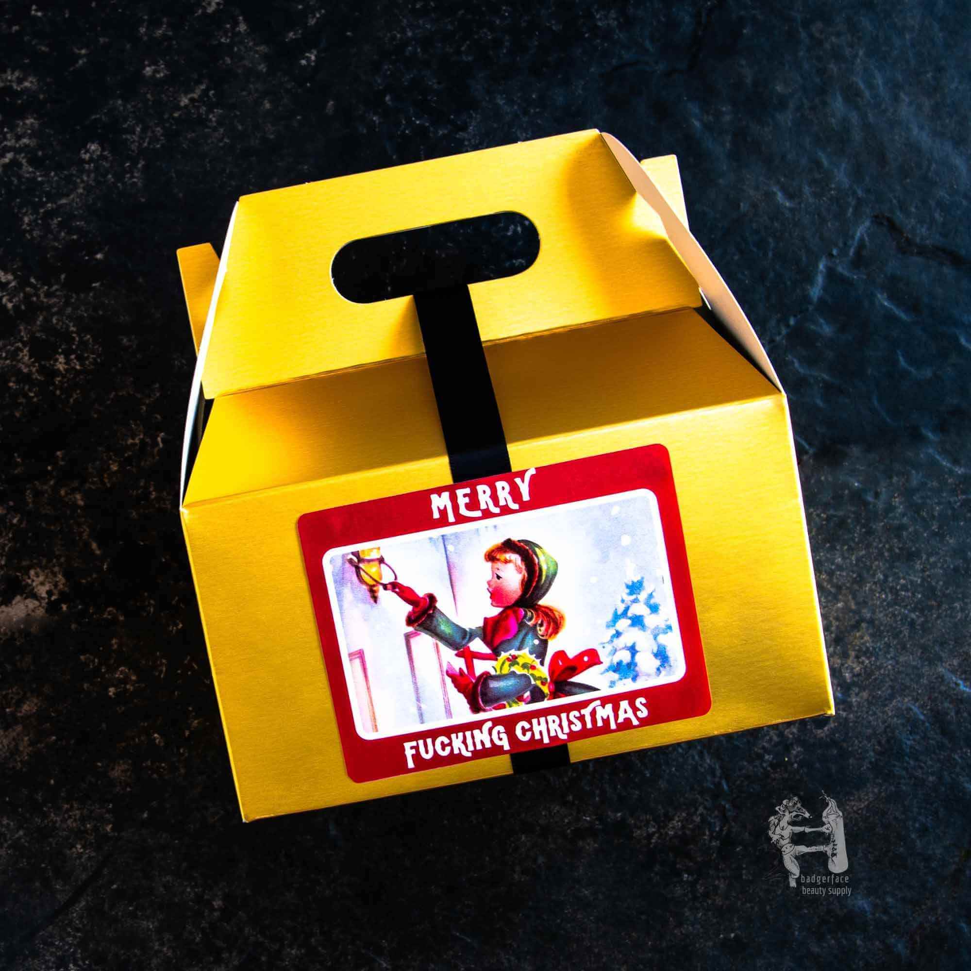 Christmas Gift Box for Women - Plasticology in yellow with humorous 'Merry Fucking Christmas' label, ideal for festive soap gift sets.